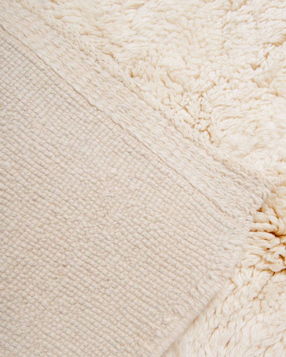 Modern, designer, handcrafted 100% sheep’s wool Berber rug from Morocco. Beni M’rirt carpet with beautiful colours and patterns and fluffy wool texture.